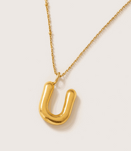 Gold bubble letter U charm necklace with 16K gold plating on stainless steel, 15-inch chain with extender, tarnish-resistant and polished design