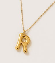 Gold bubble letter charm necklace with R pendant on gold-plated stainless steel chain