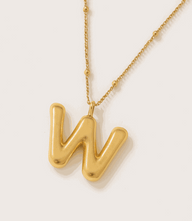 Gold bubble letter charm necklace with 16K gold overlay on stainless steel and beaded chain