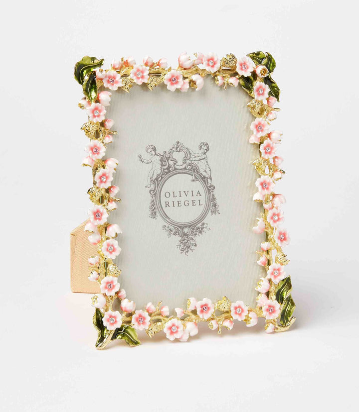 Gold pewter photo frame with hand-enameled pink flowers and hand-set crystals, floral enamel and crystal design.