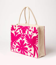 Pink embroidered tote bag with floral and wildlife designs on cotton canvas and comfortable handles