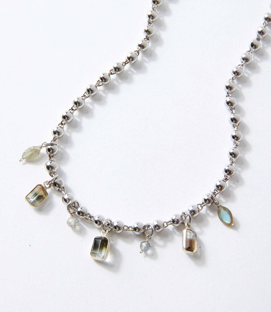 Labradorite station necklace with cubic zirconia charms on silver and gold vermeil chain