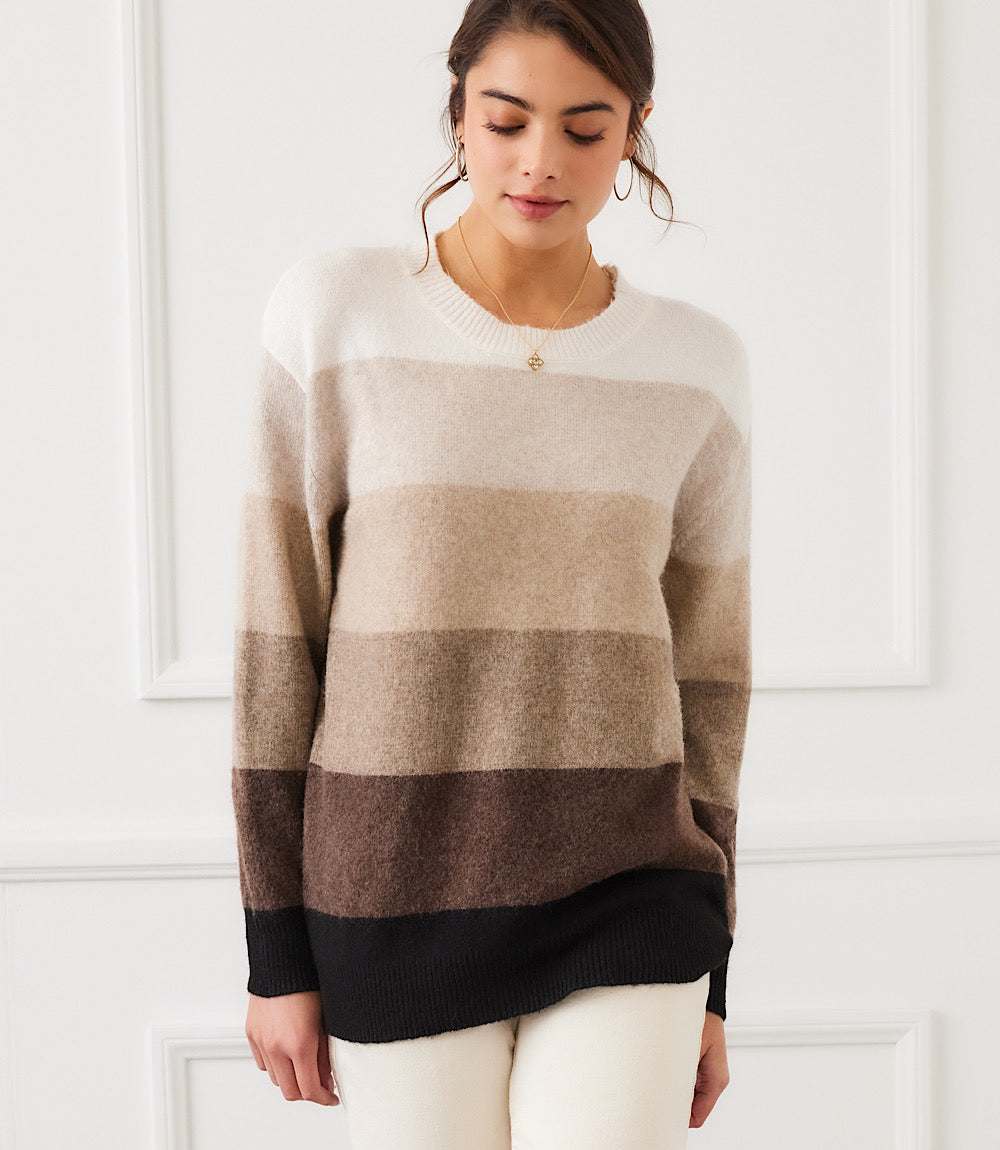 Woman wearing a cozy multi stripe crewneck sweater with tonal colorblock stripes and relaxed drop shoulder fit