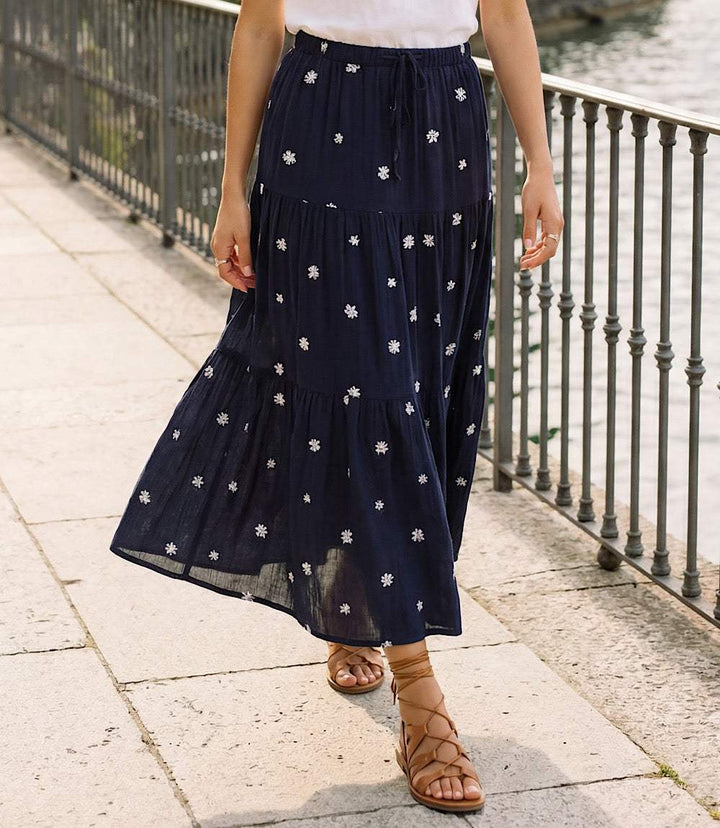Navy embroidered tiered midi skirt with floral design and front slit