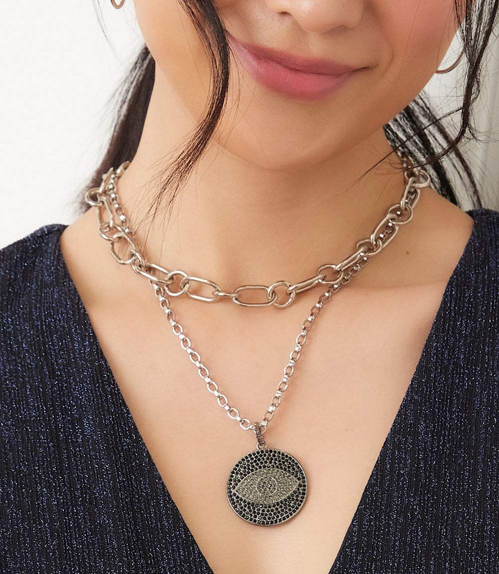 Pavé crystal pendant necklace with silver-onyx evil eye motif on rolo chain