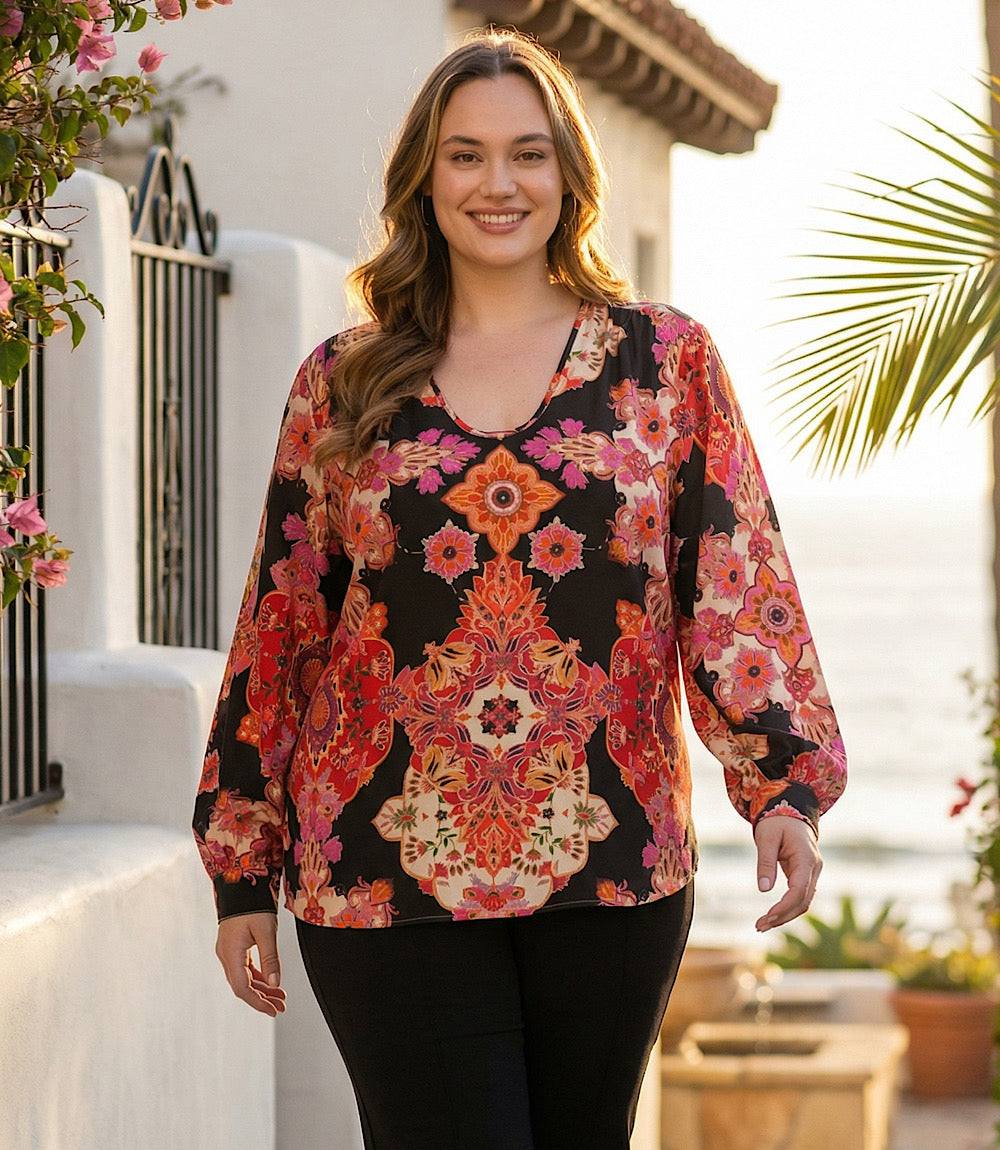Plus size long sleeve blouse with u-neckline and red floral medallion print on black background
