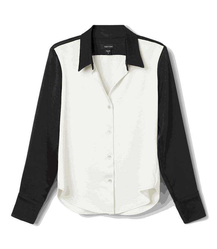 Long sleeve satin colorblock shirt with black sleeves and collar and white body, relaxed fit, button-down front.