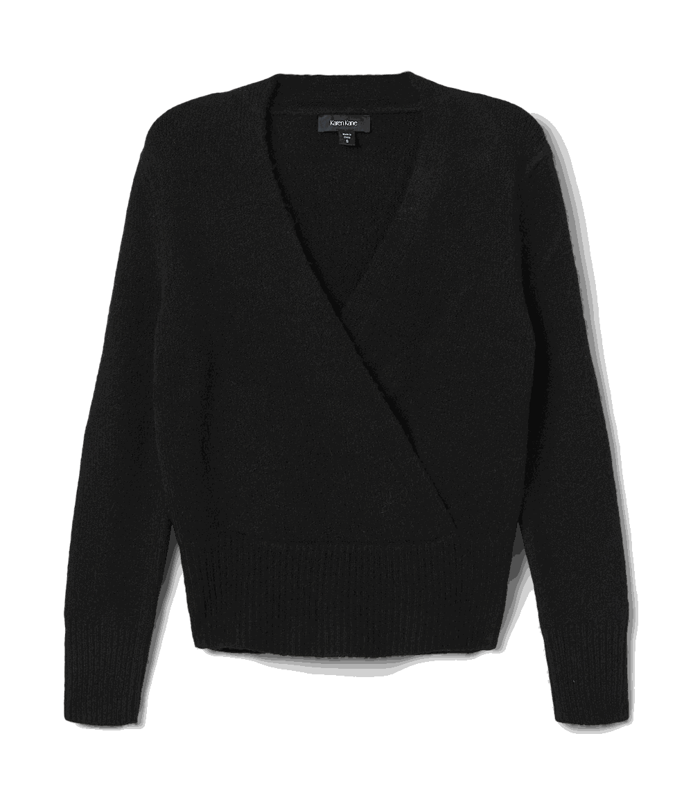 Black faux wrap sweater with crossover V-neckline, long drop shoulder sleeves, and wide ribbed hem and cuffs.