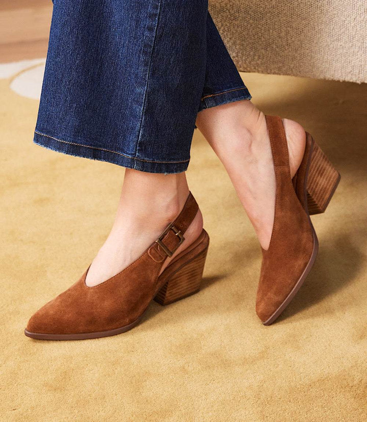 Seychelles Baby Faced Sling Back Heels in brown suede with pointed toes and block heels on model wearing jeans