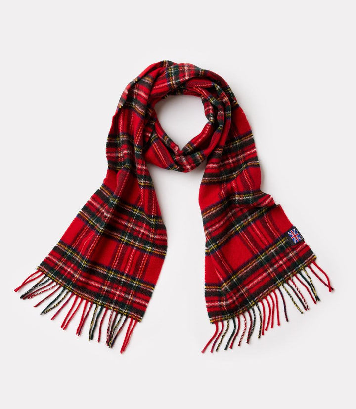 Red and black plaid merino wool scarf with fringed edges on white background