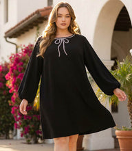 Plus size puff sleeve shift dress with embellished bow and scoop neckline