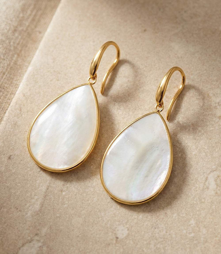 Gold plated teardrop earrings with shimmering mother of pearl shells handcrafted by artisans