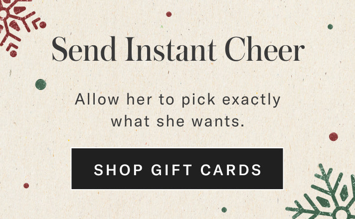 Promotional text for gift cards with decorative snowflake elements on a beige background.