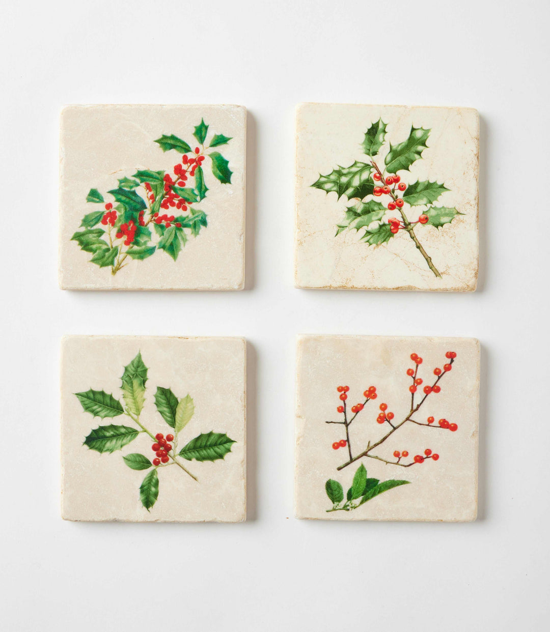 Set of 4 holly marble coasters with cork backing featuring botanical holiday designs