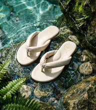 Solei Sea Gisel Thong Sandal in neutral sand color with rounded toe and wave-inspired vegan leather design