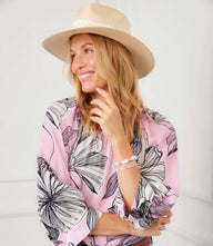 Pink blouson sleeve top with off-white and black floral print, scoop neck, and raglan sleeves in lightweight cupro fabric