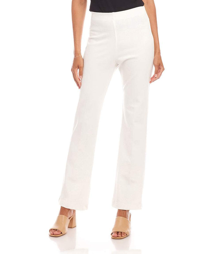 White bootcut pants with elastic waistband and high rise, styled with beige open-toe heels.