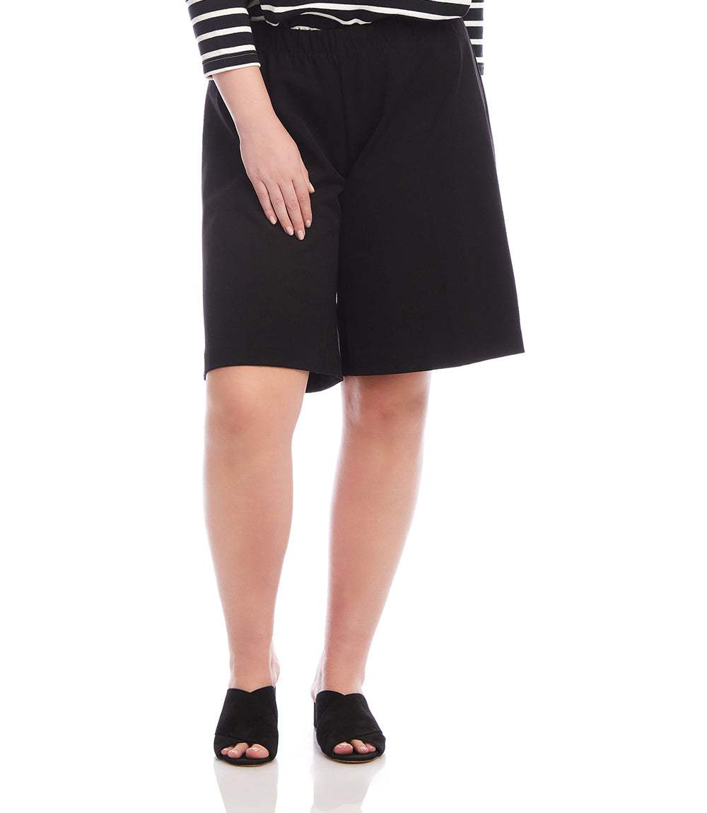 Plus size black A-line shorts with elastic waistband and pull-on design made from double stretch twill fabric.