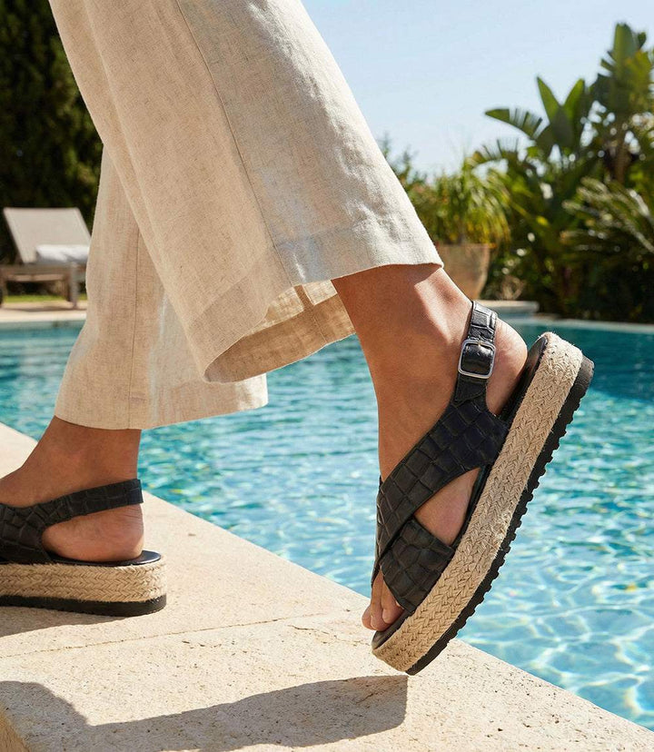 Handmade leather espadrille sandals with crisscross design and beaded details