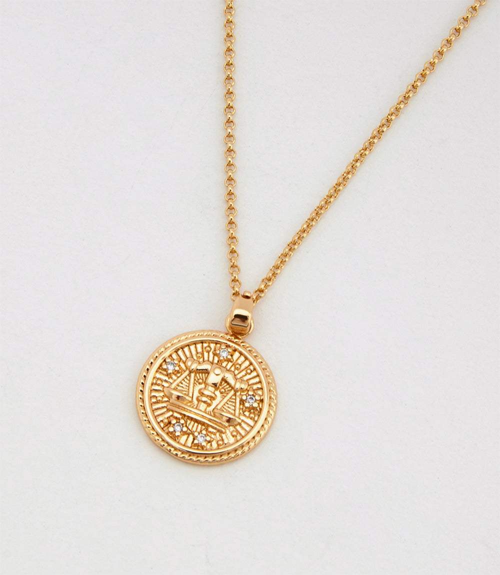 Gold Libra Coin Necklace with micro pave cubic zirconia stones on a delicate chain, 18k solid gold filled, 18-inch length, pendant size 0.75 inch.