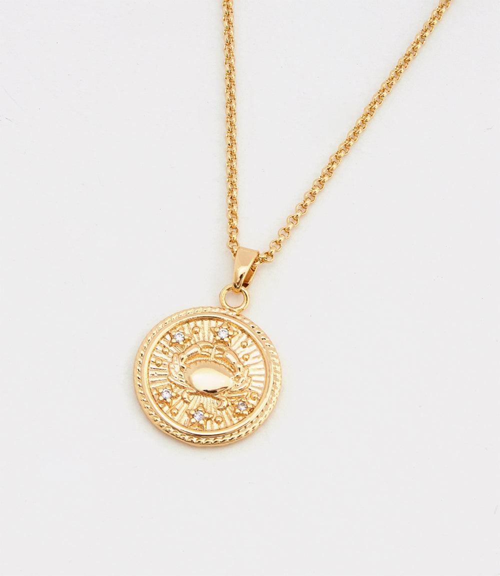 Cancer Coin Necklace with 18k gold filled pendant featuring zodiac crab symbol and cubic zirconia stones on gold chain