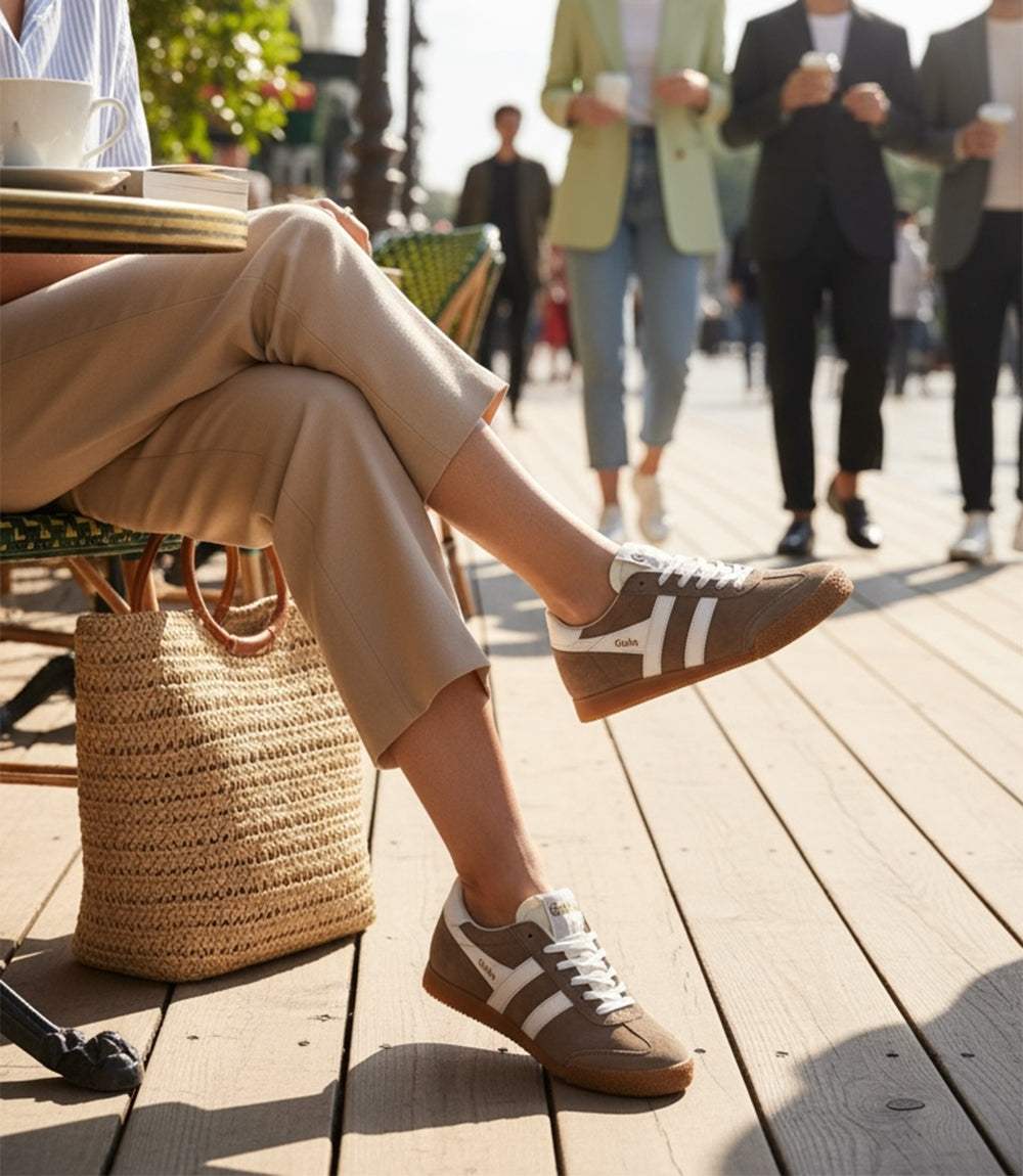 Gola Elan Classic Sneakers in mocha suede with white stripes and gum sole worn outdoors