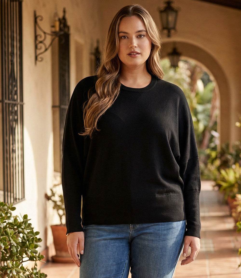 Plus size dolman sleeve sweater with crew neck and ribbed cuffs in relaxed fit