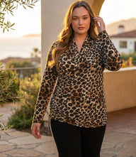 Plus size long sleeve animal print crossover top with side shirring and fitted silhouette