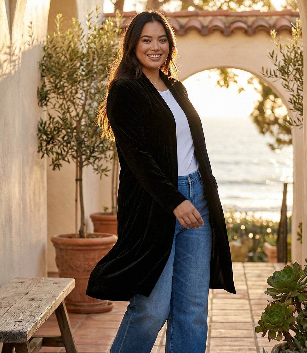 Plus size velvet duster with open front, set-in sleeves, side slits, and front pockets in stretch velvet fabric