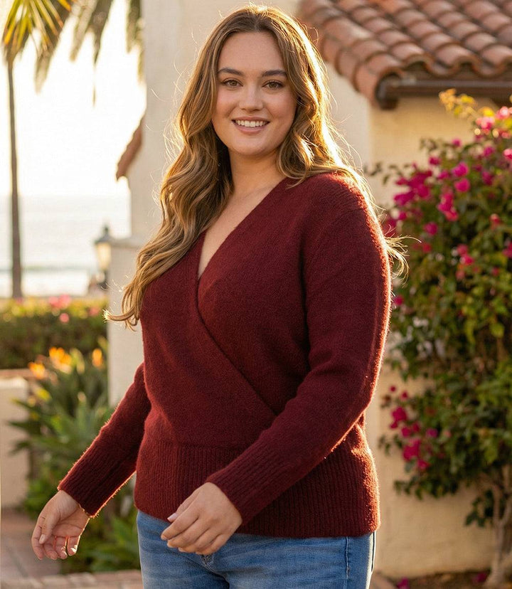 Plus size wrap sweater with crossover V-neck and ribbed hem in plush knit