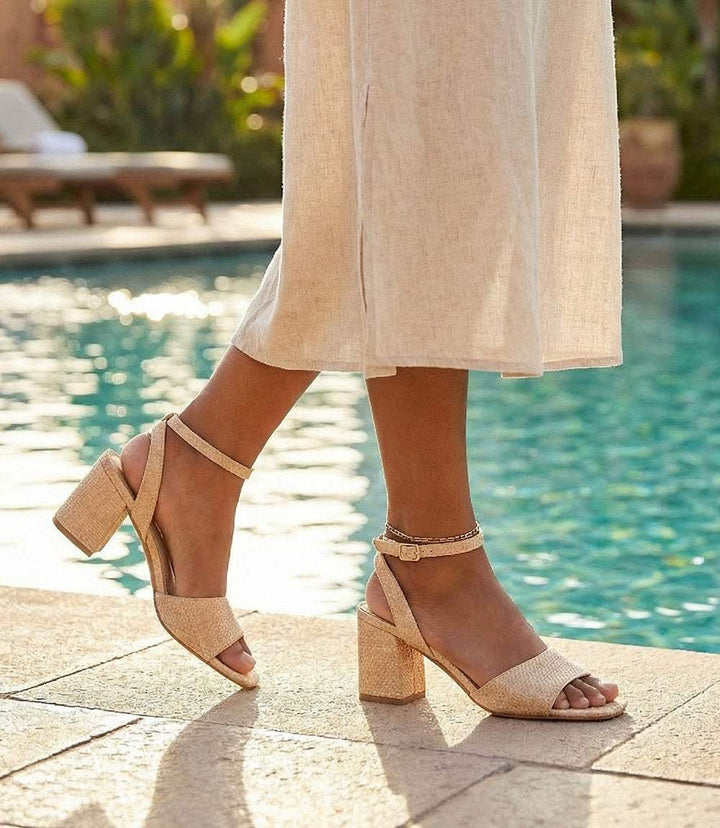 Simple Pleasures Raffia Heel Sandals with pink blush raffia upper, square toe, block heel, and ankle strap closure
