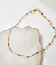 Multi Gemstone Necklace with colorful gems on a delicate gold chain, 16.5 inches long with 2-inch extender.