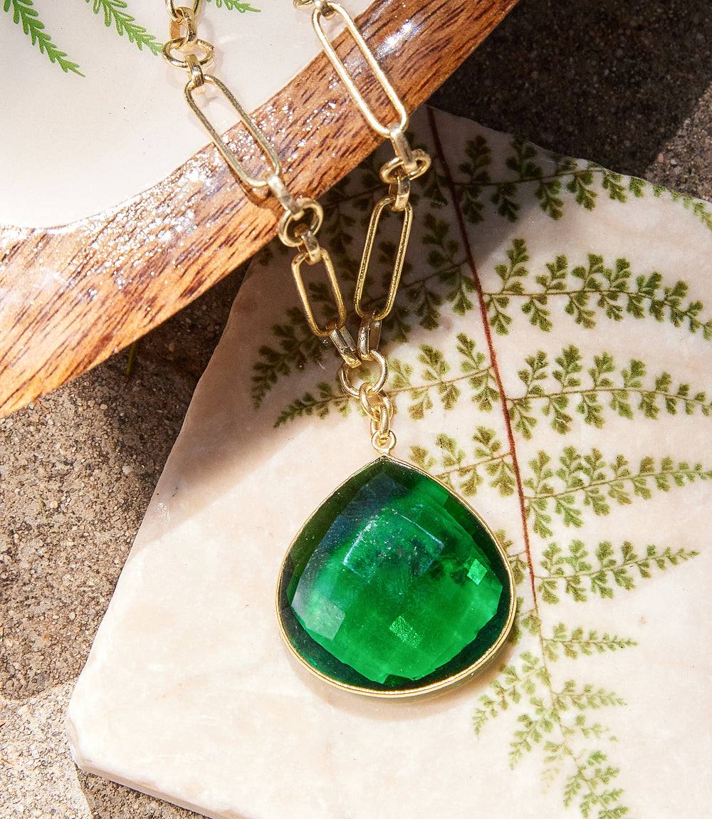 Emerald quartz pendant necklace with faceted green glass stone in gold-plated brass bezel on paperclip chain