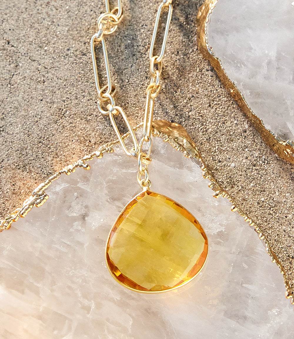 Faceted golden citrine quartz pendant on gold-plated chain necklace