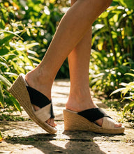 Charleston Shoes Porter two-tone wedge sandals with black and natural linen wide crisscross straps and 2.75-inch heel
