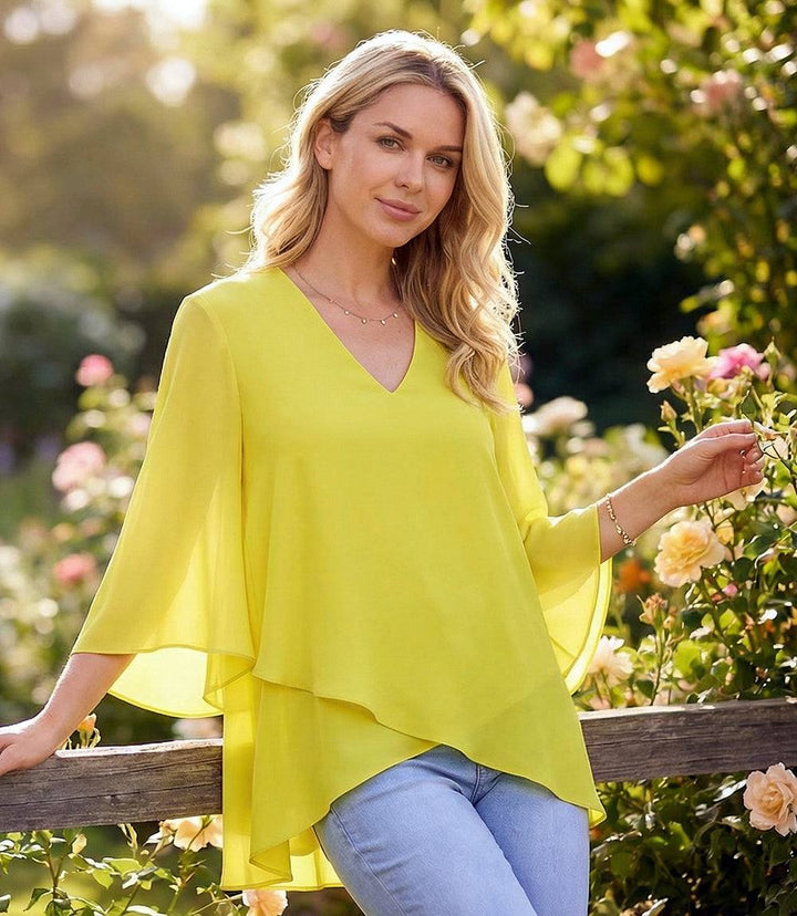 Bracelet Sleeve Asymmetric Top in silky crepe with layered asymmetrical hem and flare sleeves