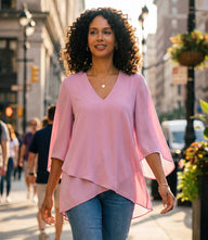 Bracelet Sleeve Asymmetric Top in silky crepe with V-neck, flare sleeves, and layered asymmetrical hem