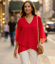 Bracelet Sleeve Asymmetric Top in silky crepe with V-neck, flare sleeves, and layered asymmetrical hem for elegant comfort