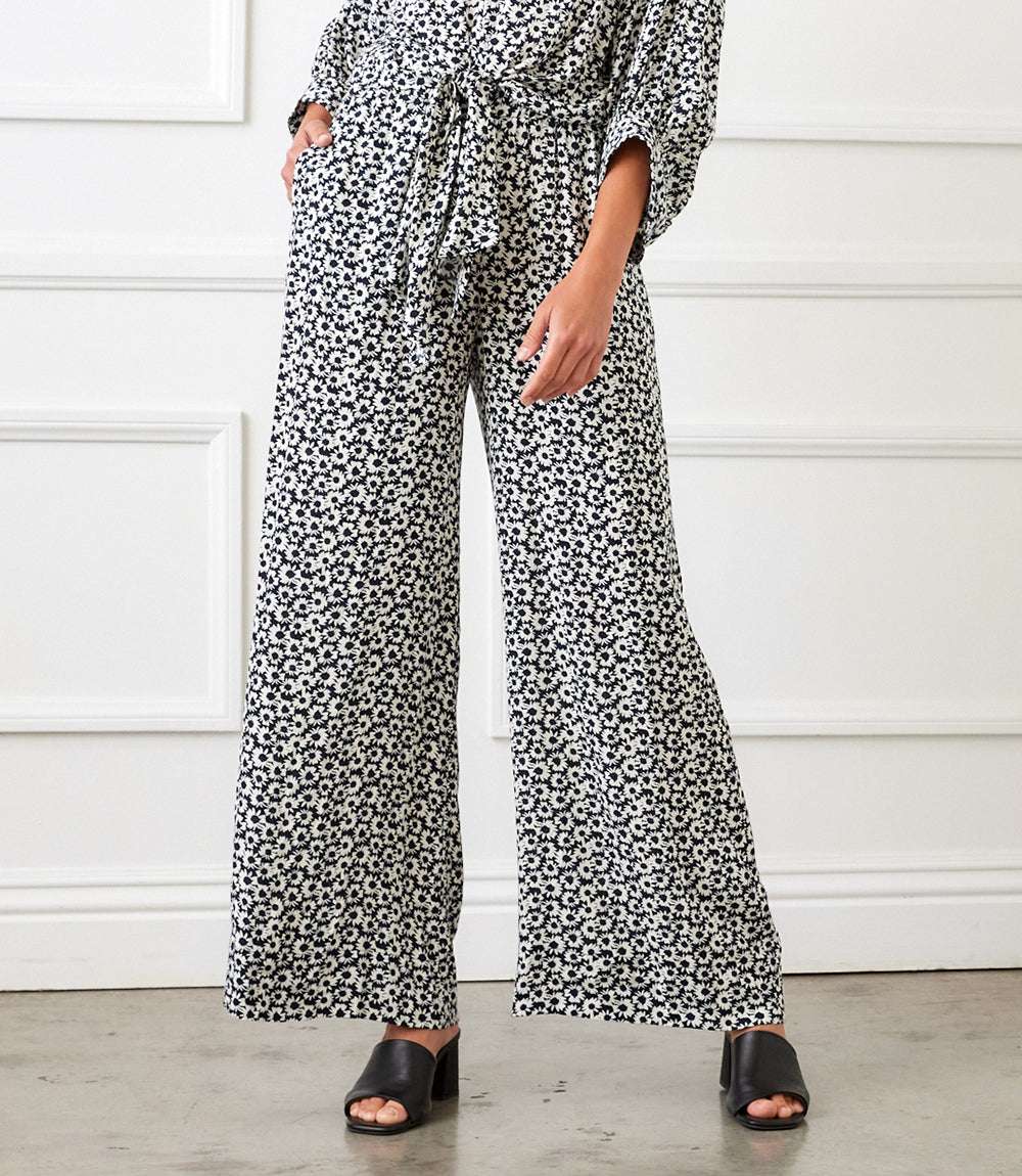 Blue daisy print rayon wide-leg pants with elastic waistband and side pockets