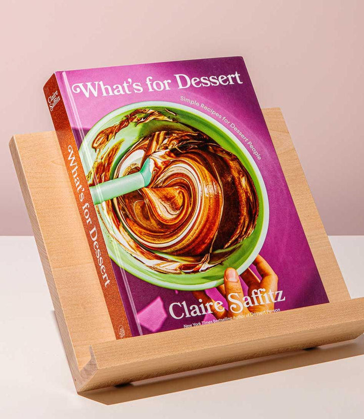 What's For Dessert cookbook by Claire Saffitz with dessert recipes displayed on wooden book stand