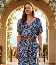 Blue puff sleeve peasant top with floral print and gathered neckline