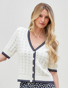 woman wearing white sweater