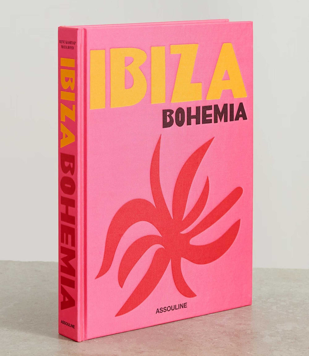 Ibiza Bohemia hardcover coffee table book with pink cover and bold yellow and black text