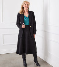 Faux suede midi skirt in soft knit with elastic waist, mid-length, styled for elegant comfort