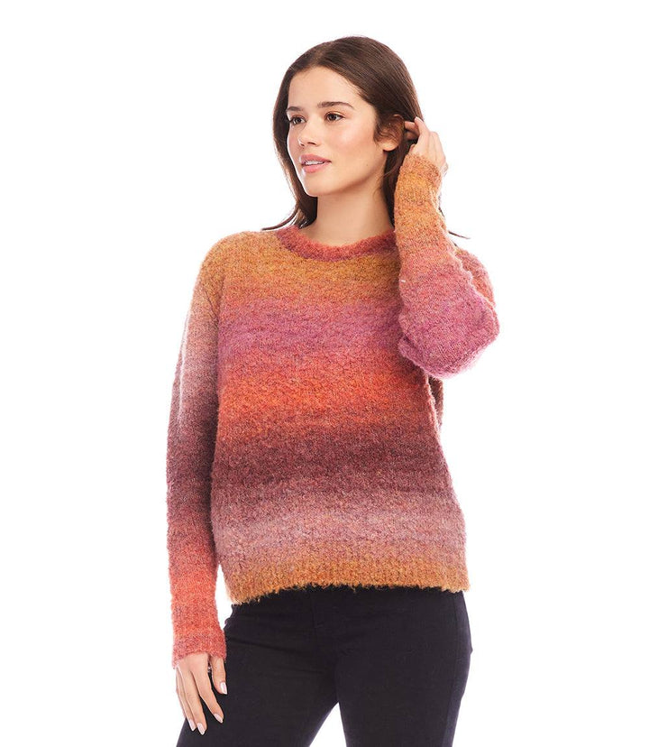 Woman wearing a loose-fit Ombre Boucle Sweater with soft textured knit in warm gradient colors and crew neck.
