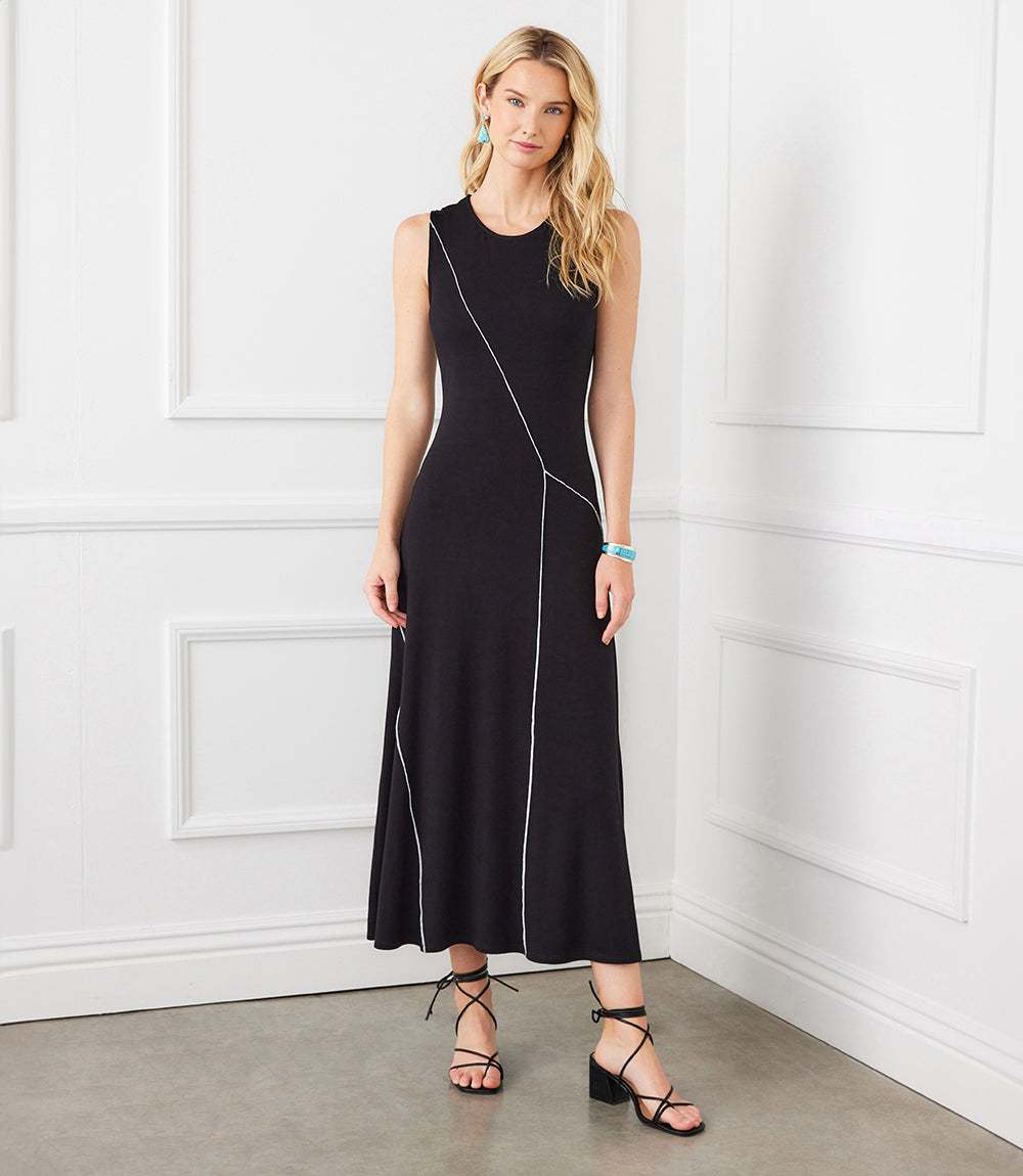 Sleeveless black reverse seam dress in rayon spandex jersey with crew neck and modern diagonal seam detail