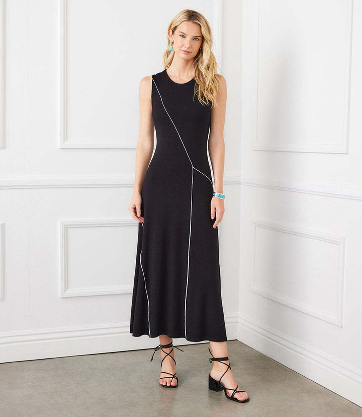 Sleeveless black reverse seam dress in rayon spandex jersey with crew neck and modern diagonal seam detail