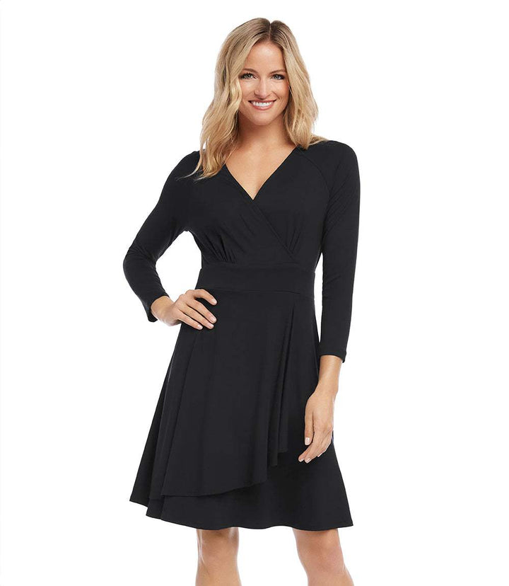 Petite size faux wrap black dress with 3/4 sleeves and surplice neckline on smiling woman