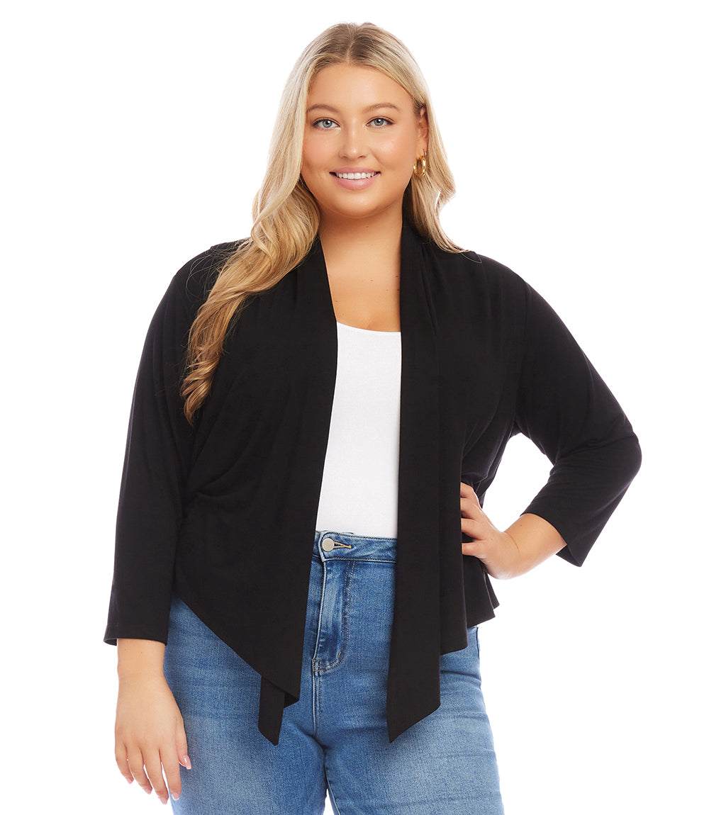 Plus Size Calli Cardigan in black with draped front, 3/4 sleeves, and hi-low hemline worn with white top and blue jeans