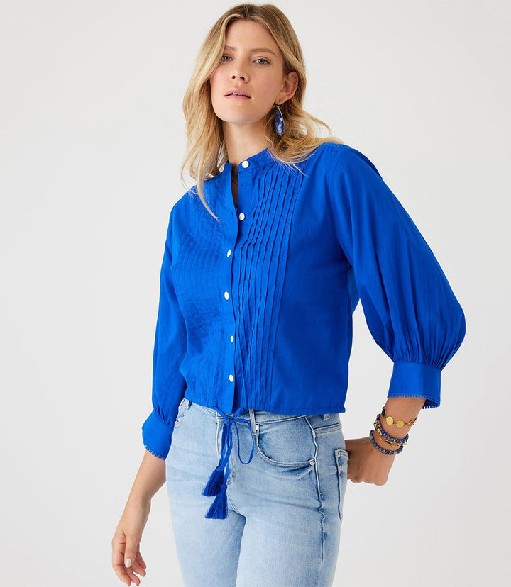 Blue lace trim drawstring top with bishop sleeves and mandarin collar worn with jeans